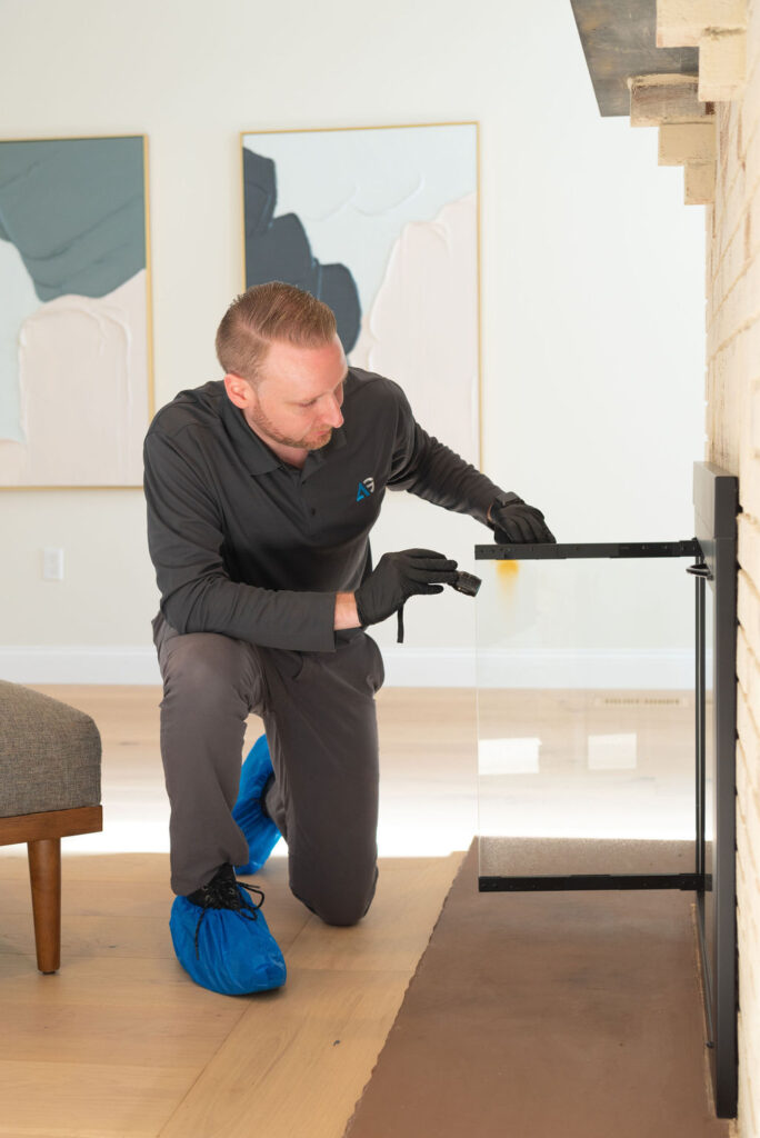 Agile Pest Control technician inspecting a fireplace for pest activity in Monmouth County, NJ