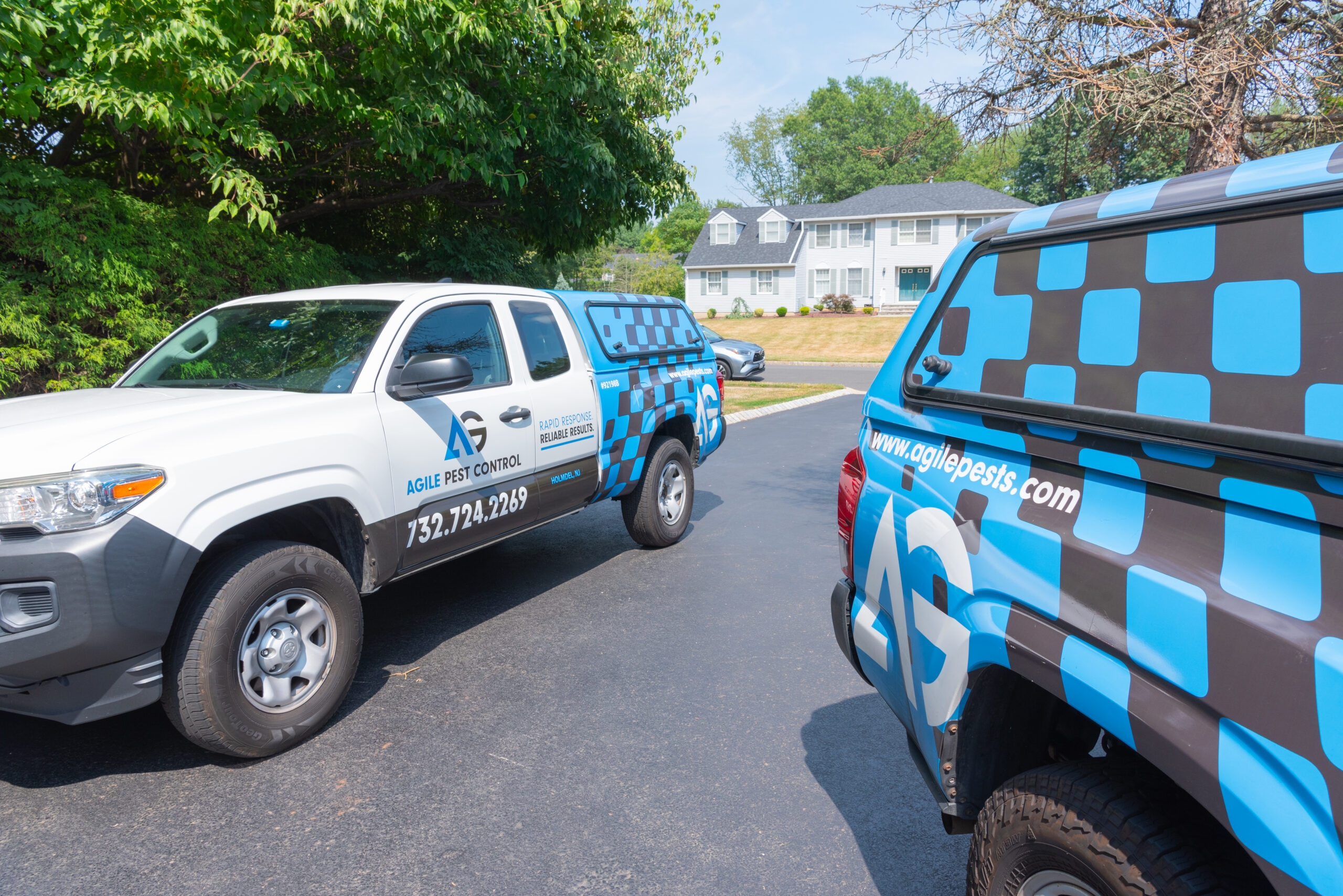 Agile Pest Control technician servicing a home in Oceanport, NJ