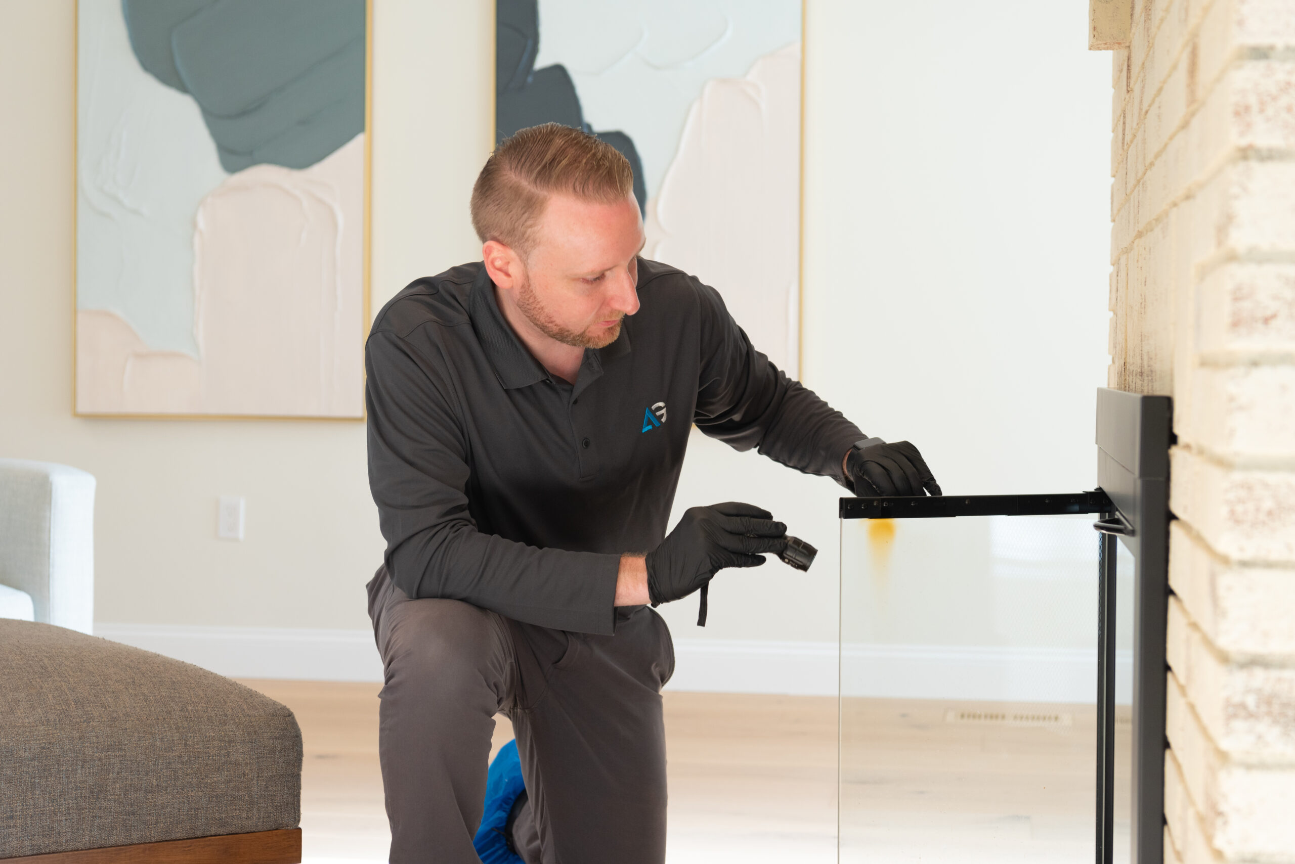 Agile Pest Control technician conducting a thorough inspection inside a home in Oceanport, NJ, as part of a comprehensive rodent control service.