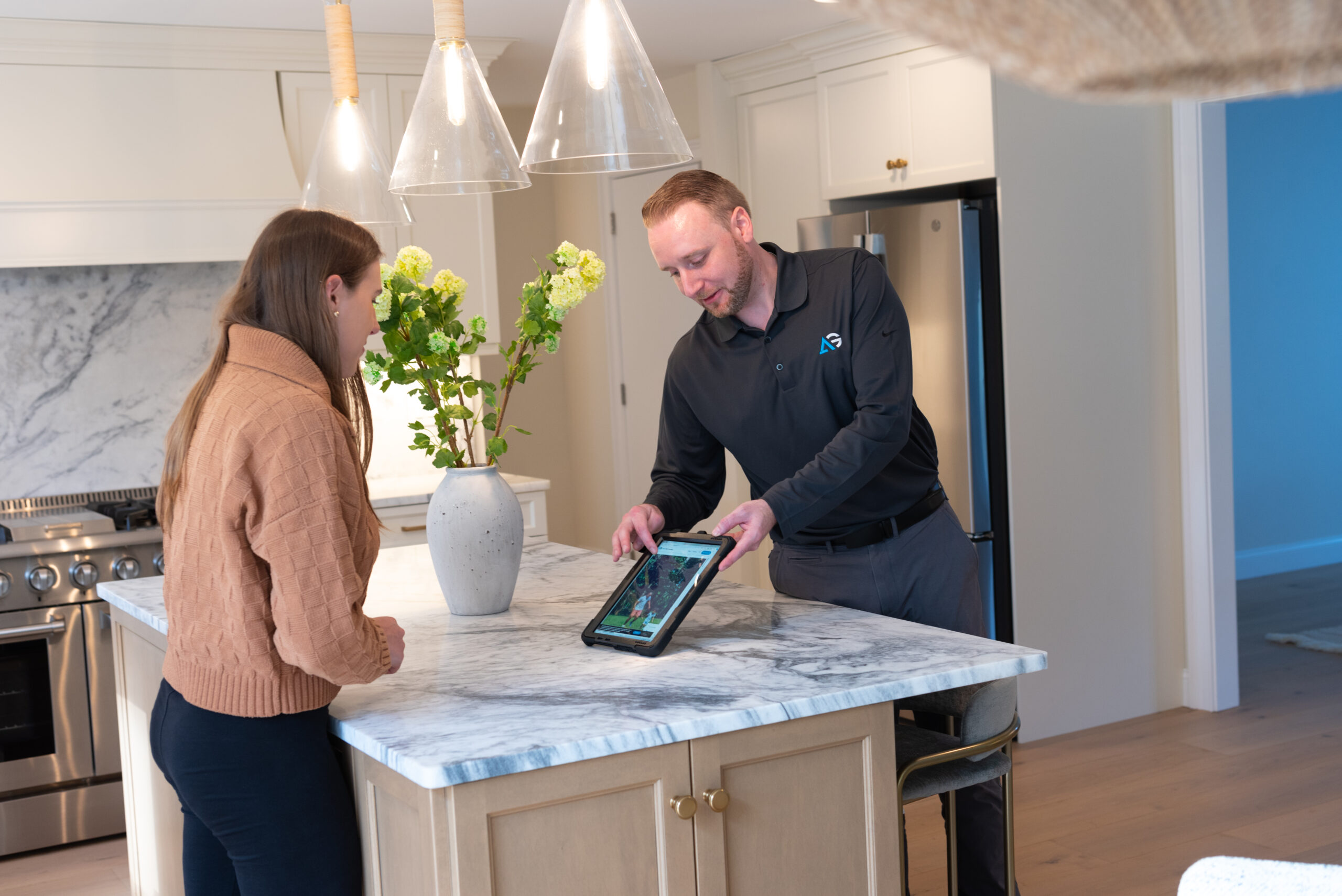 Agile Pest Control technician walking a customer through a detailed proposal in Little Silver, NJ, ensuring clear communication and tailored pest control solutions.