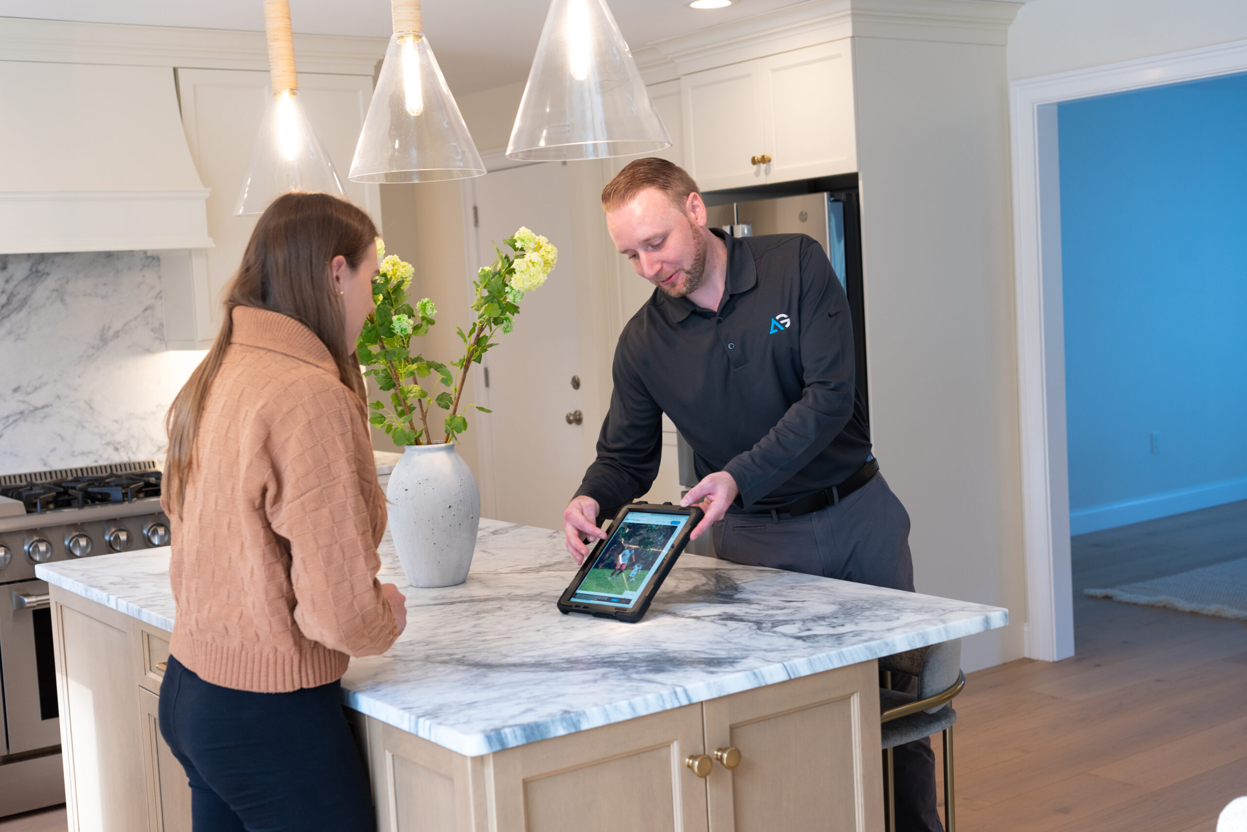 Agile Pest Control technician reviewing a rodent control proposal with a customer in Red Bank, NJ, ensuring a clear understanding of the service plan.