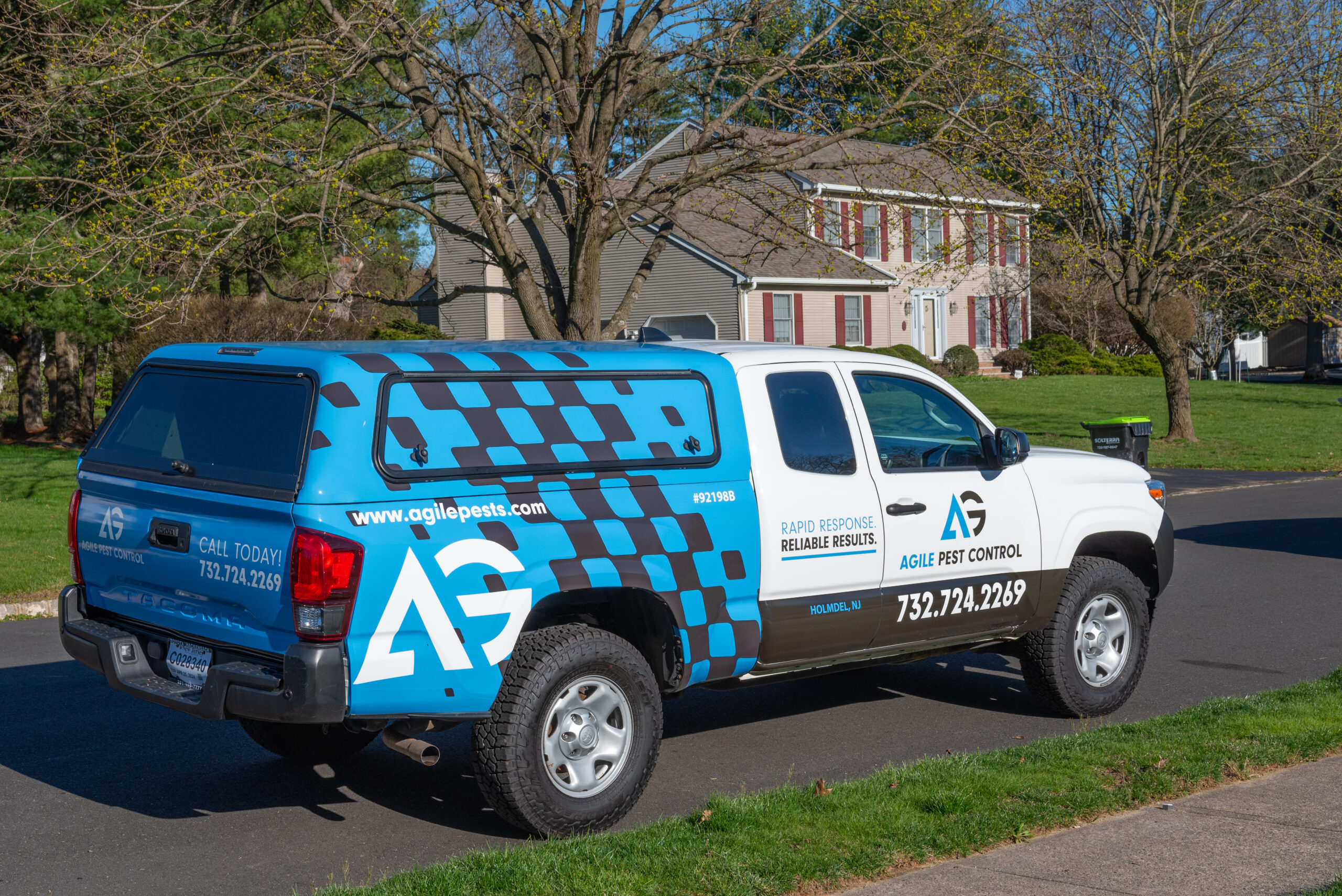 Agile Pest Control truck parked in front of a home in Brick, NJ, ready to perform a rodent control service.