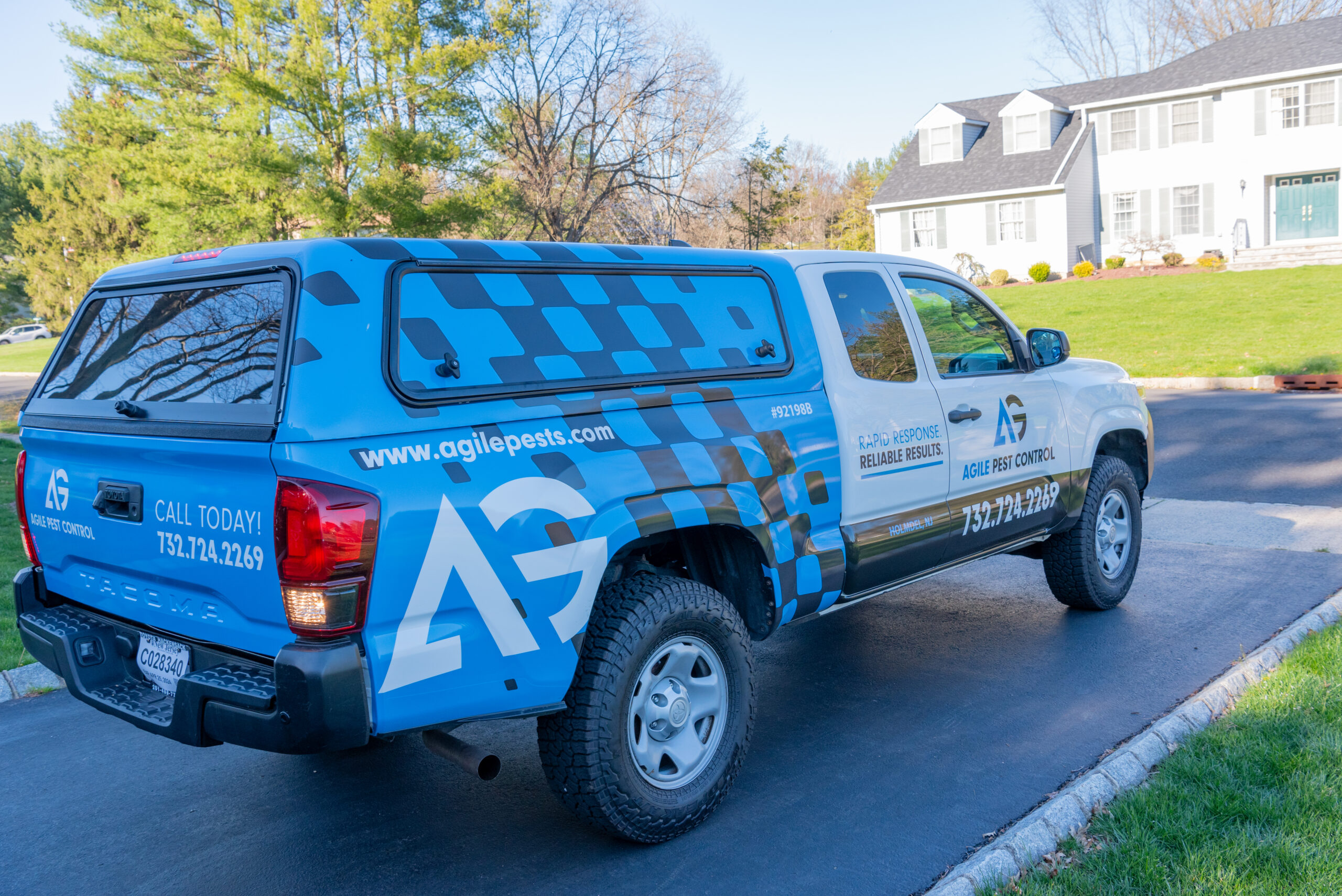 Agile Pest Control truck arriving at a residential home in Brick, NJ, ready for a scheduled bed bug control service, showcasing the company's prompt and professional response to pest issues in local neighborhoods.