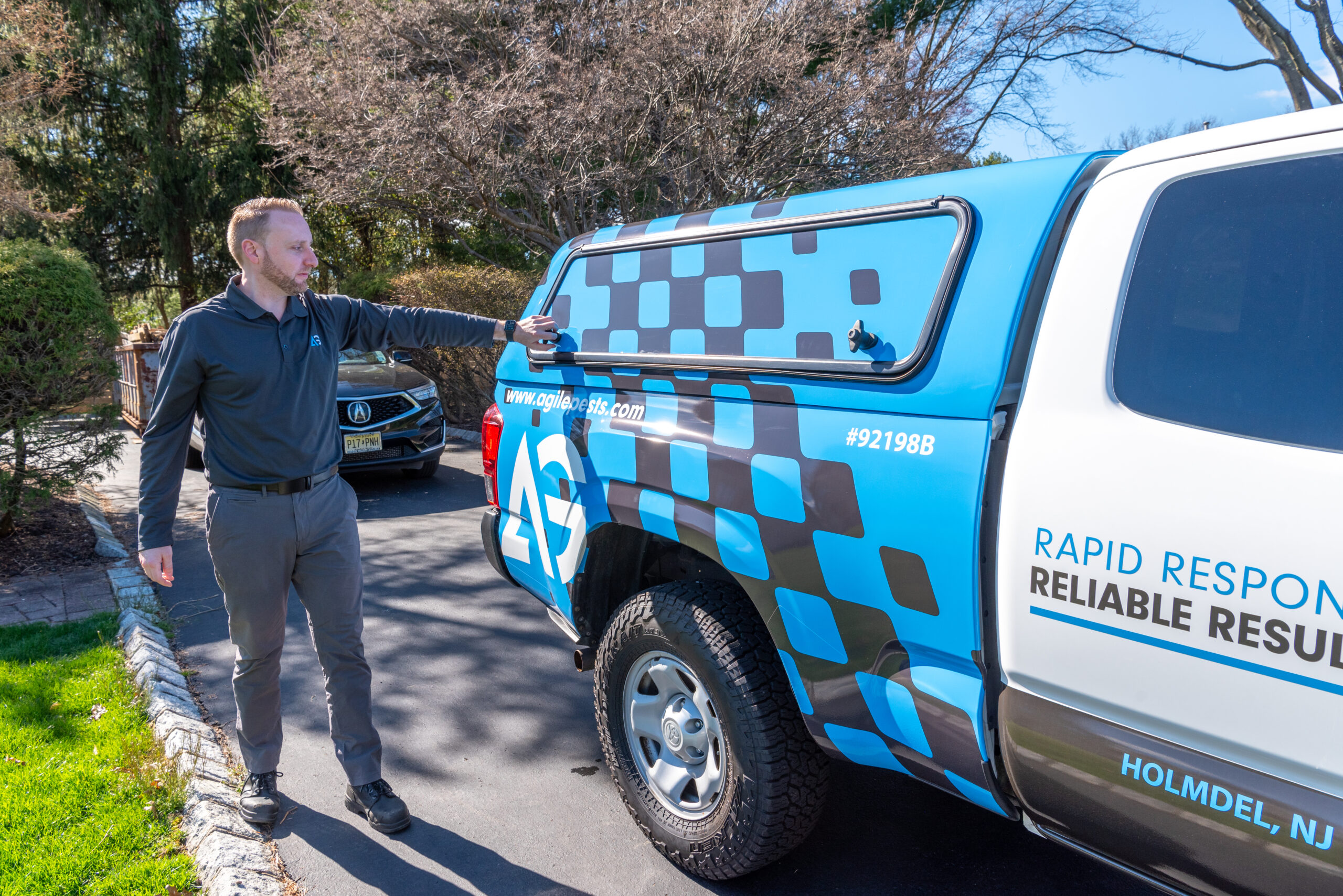 Agile Pest Control technician arriving at a home in Tinton Falls, NJ for a thorough bed bug control inspection, equipped and ready to assess the property for signs of infestation.