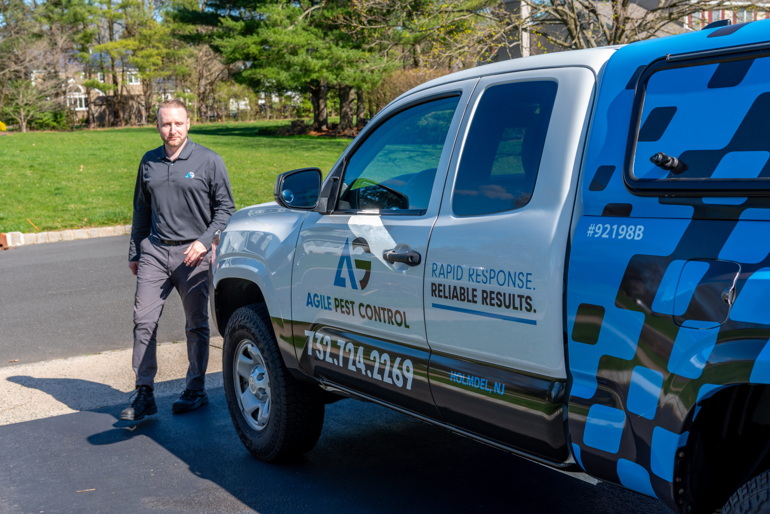 Agile Pest Control technician arriving at a home in Holmdel, NJ, equipped to perform professional ant control services, ensuring fast and effective pest management.