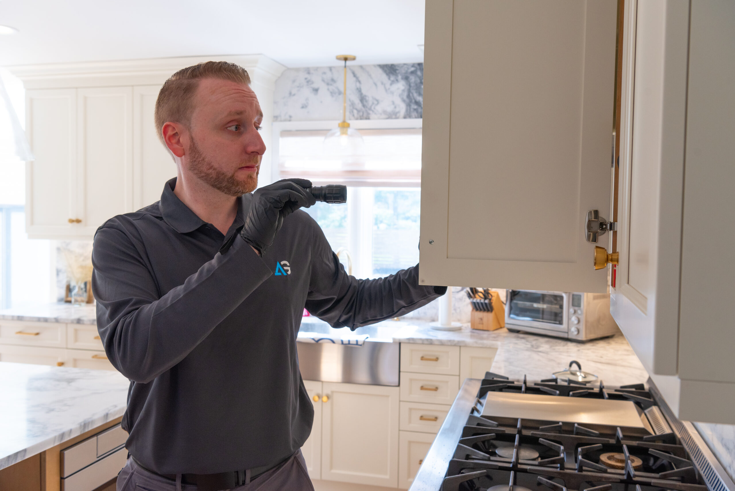 Agile Pest Control technician performing a thorough bed bug control treatment at a home in Red Bank, NJ, targeting affected areas to ensure complete elimination of the infestation.