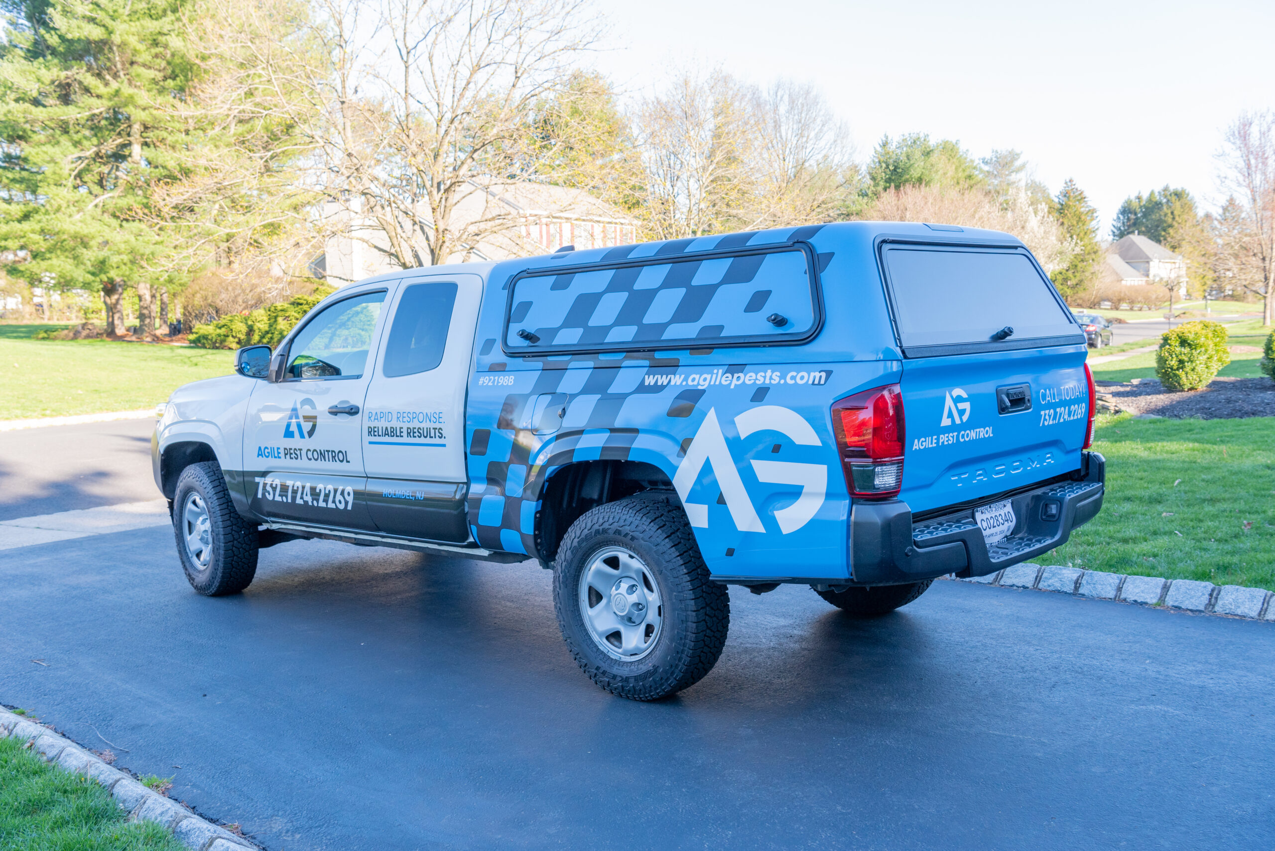 Agile Pest Control technician arriving at a residential property in Freehold, NJ, equipped for a detailed bed bug inspection. The technician, wearing a professional uniform and carrying inspection tools, approaches the front entrance to provide local expertise in bed bug detection and removal, ensuring high-quality service for the homeowner.