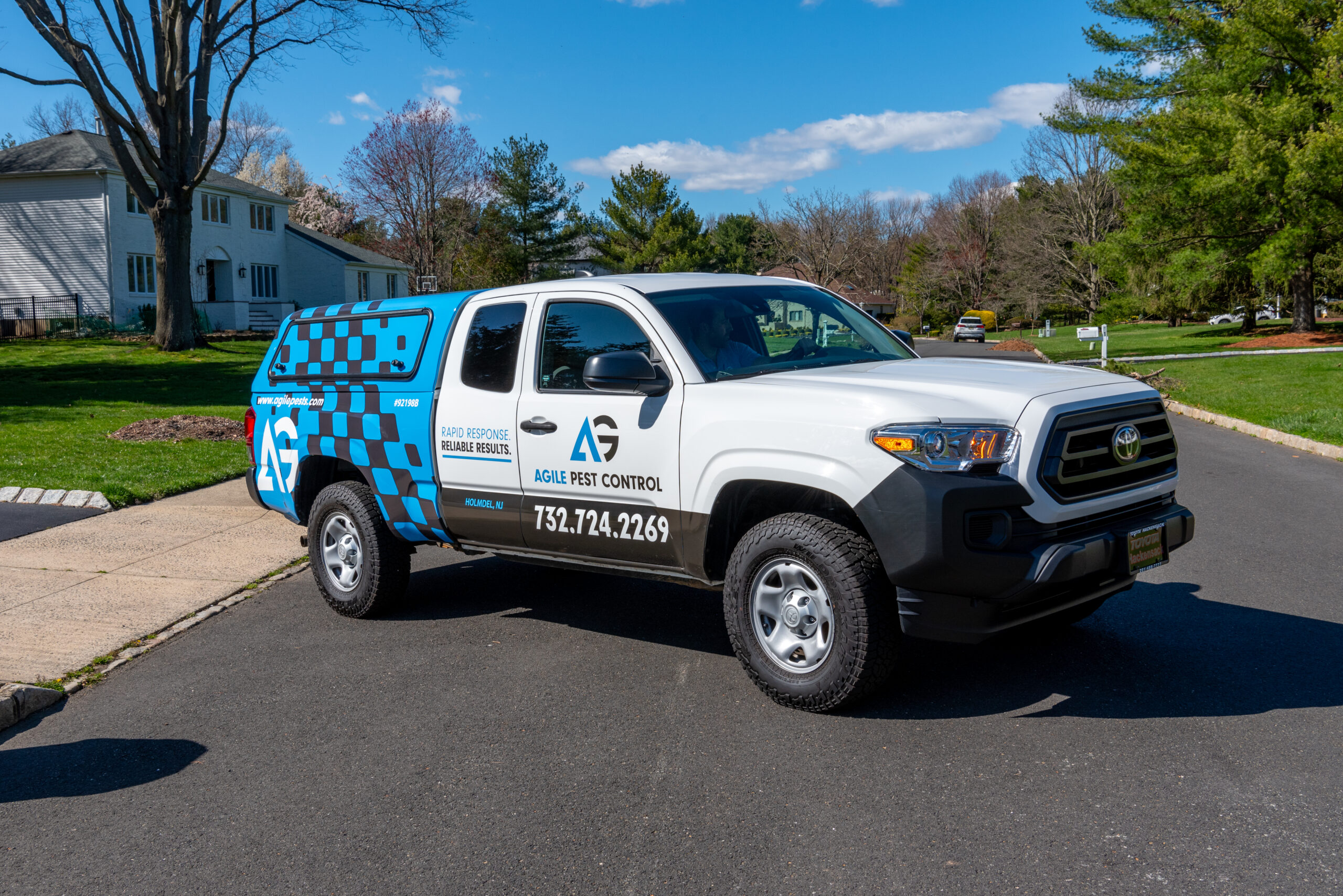 Agile Pest Control technician performing a mosquito inspection at a Monmouth County, NJ property