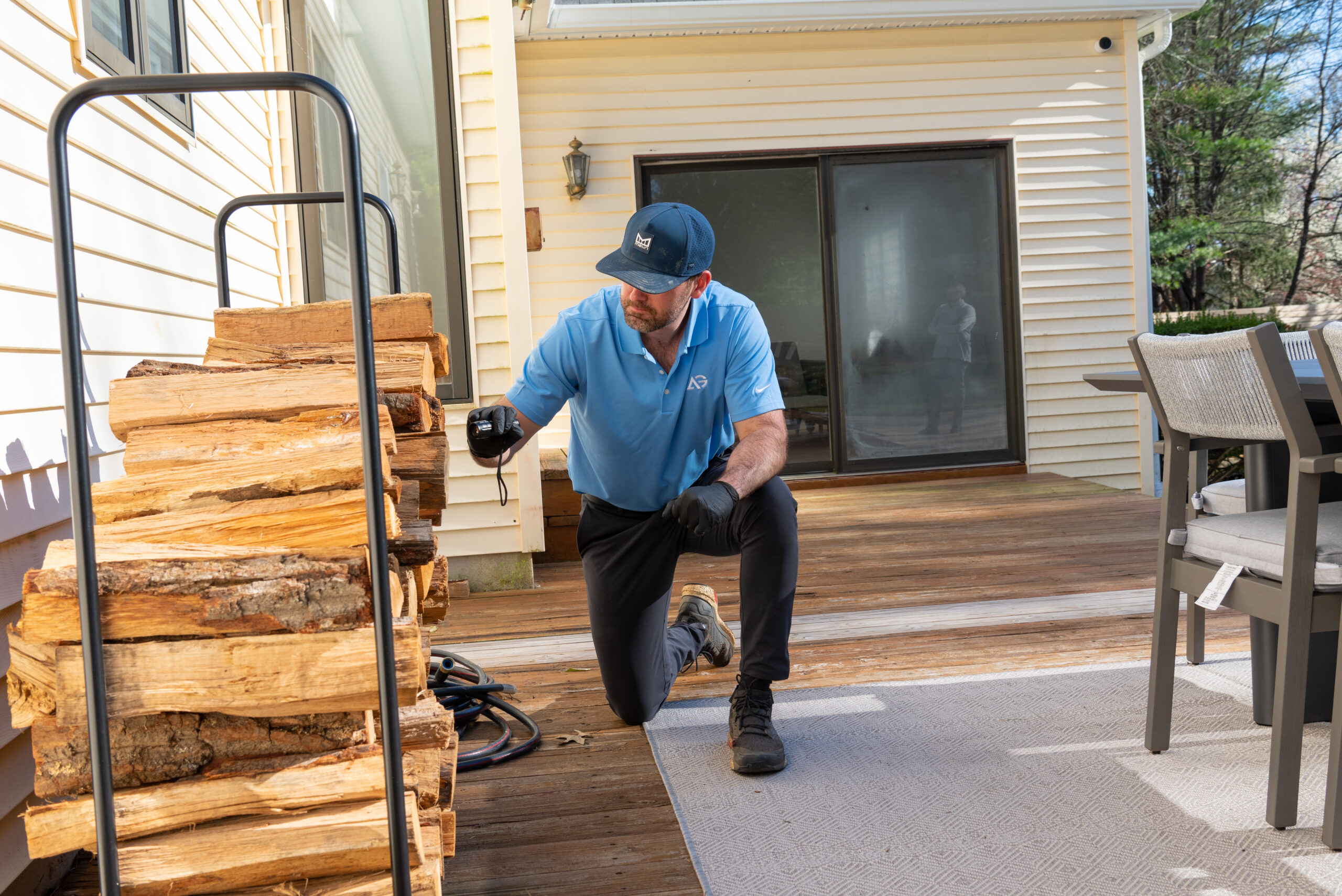 Agile Pest Control technician conducting an inspection for mouse exclusion at a Monmouth County, NJ property.