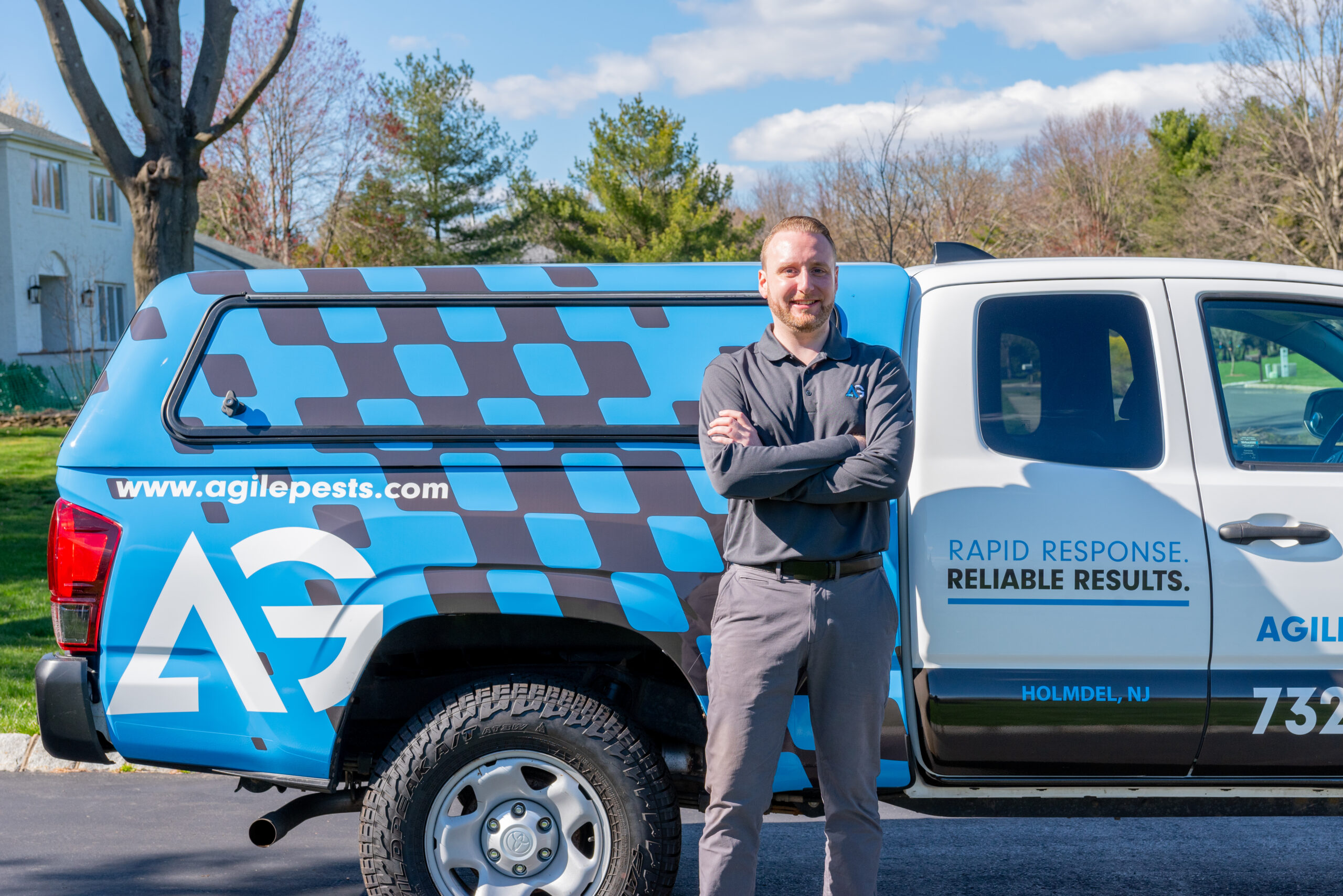 Agile Pest Control technician performing an inspection for rodent removal at a Monmouth County, NJ property.