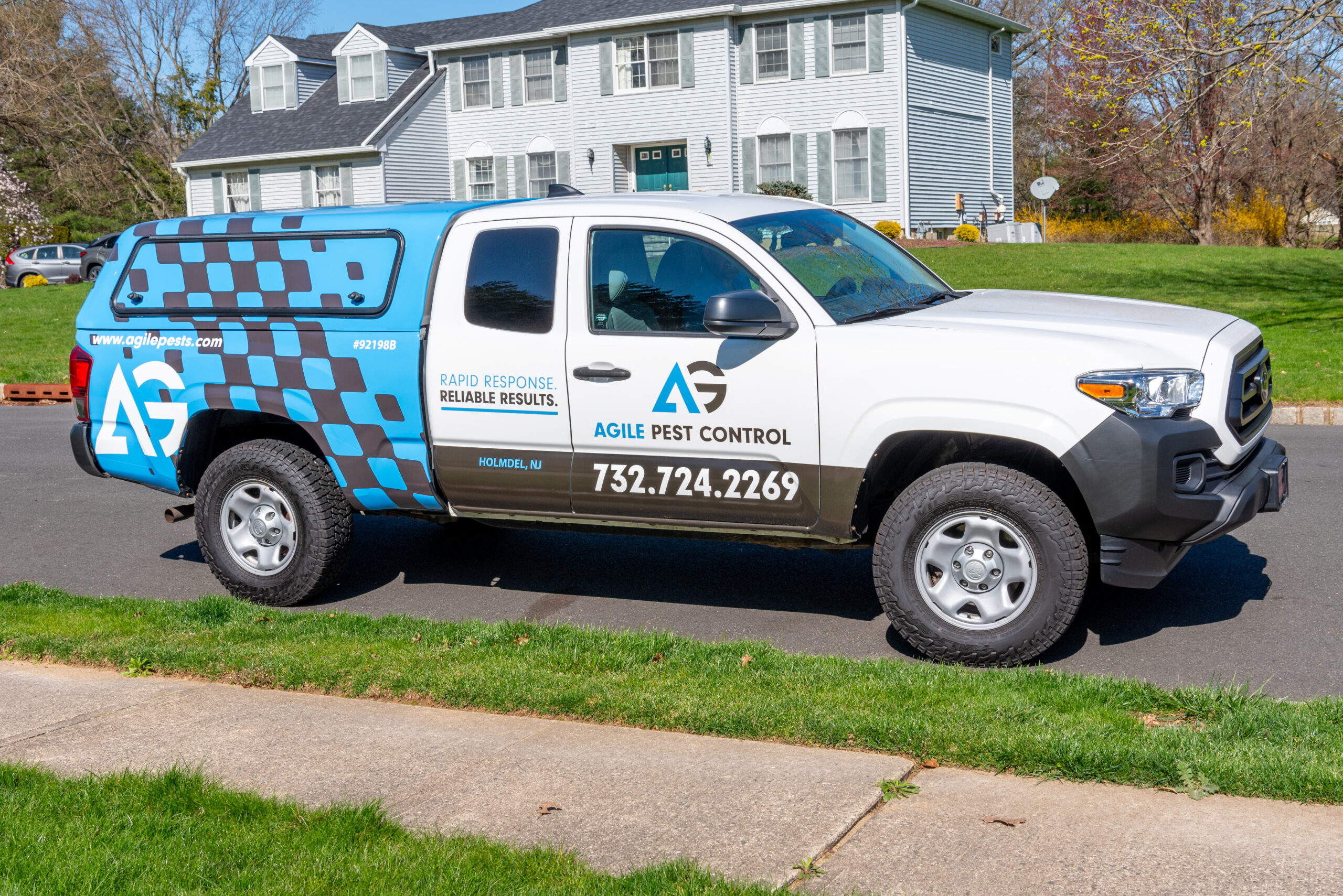 Agile Pest Control technician performing an inspection for stinkbug control at a Monmouth County, NJ property