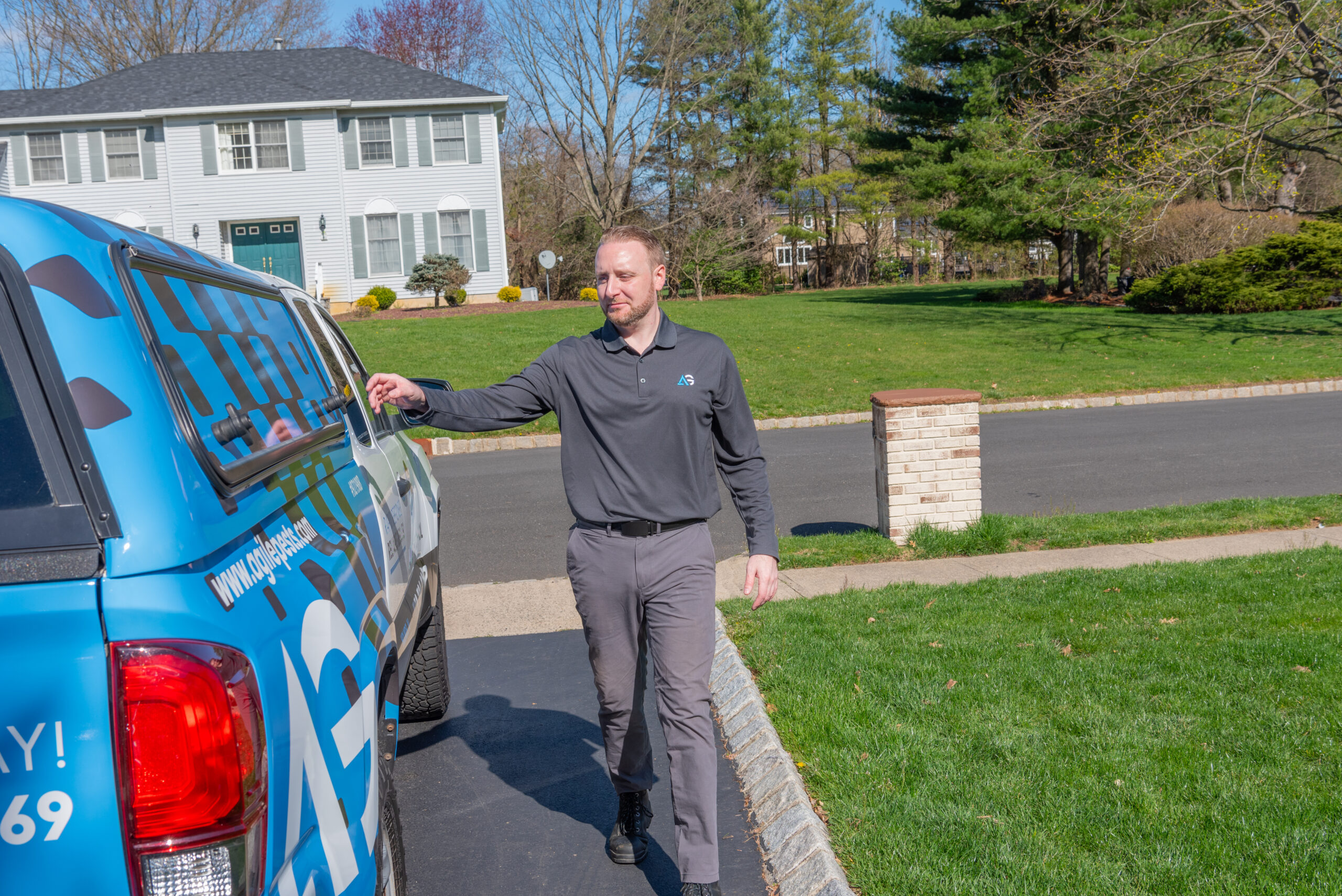 Agile Pest Control technician performing groundhog removal in Monmouth County, NJ, providing expert wildlife management solutions.
