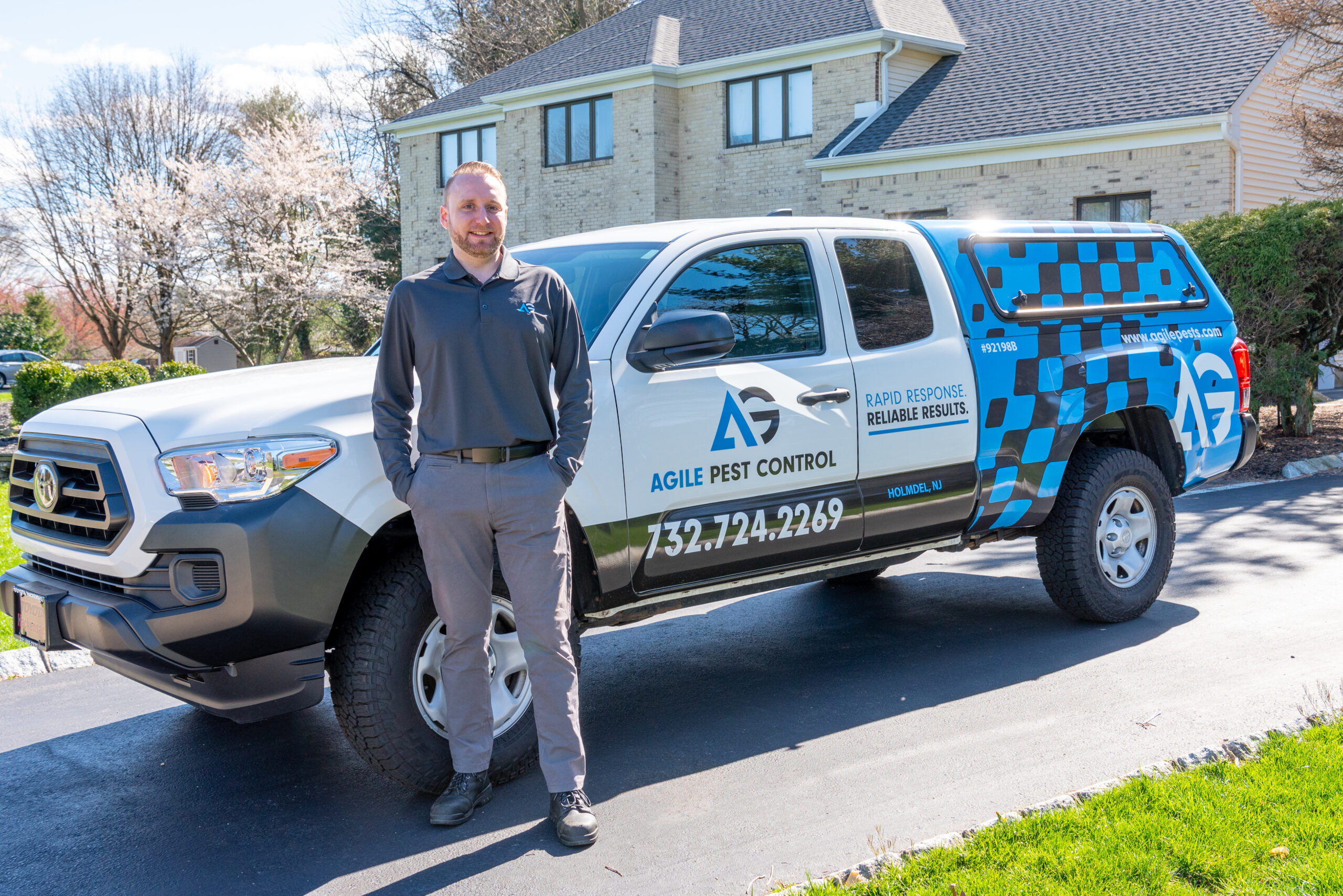 Agile Pest Control technician performing mole control services in Monmouth County, NJ, providing safe and effective lawn protection.