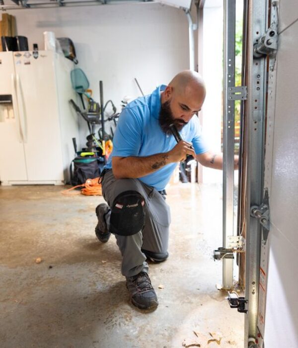 pest control technician inspecting entry points for ant activity and treatment
